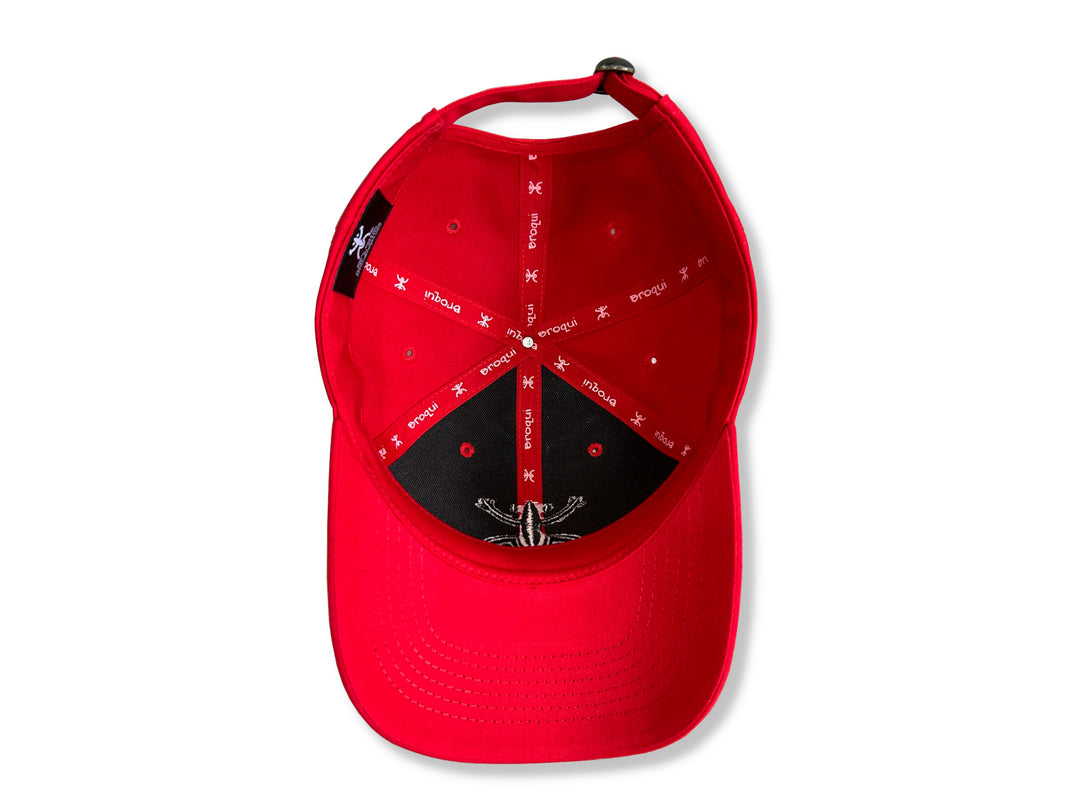 Stylish Red Broqui hat featuring the iconic Coquí symbol in Black, inspired by Puerto Rican heritage.